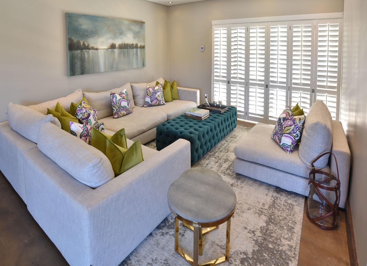 Tredenham Boutique Hotel Bloemfontein Eksteriør bilde A living room with plantation shutters